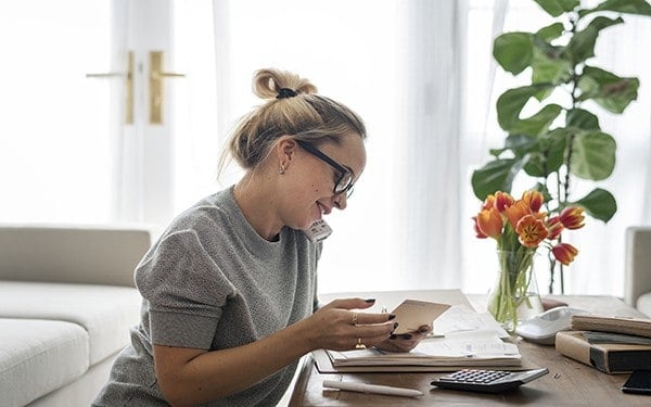 Freelance female working from living room at home