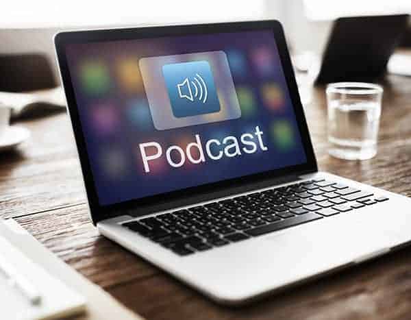 The podcast app open on a macbook