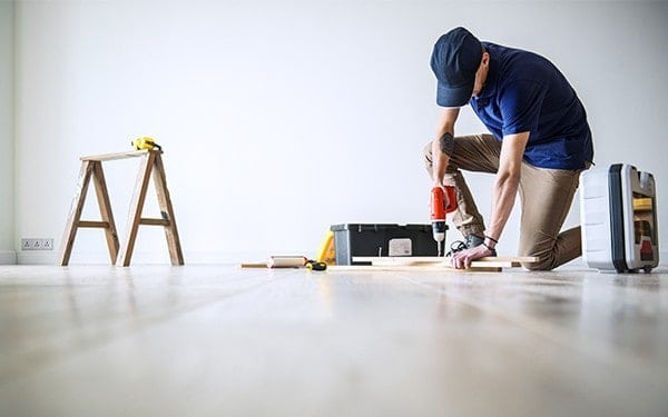 Tradesman completing job with tools on site