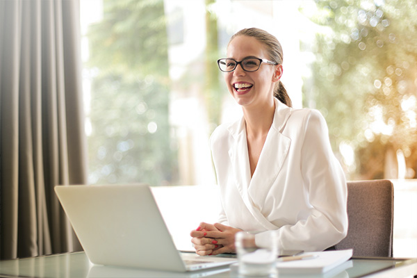 Lady smiling as she works from home