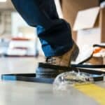 A person about to trip over a cable tie at work